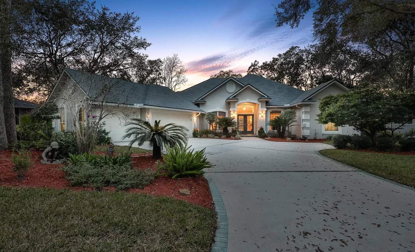 The Queen's Harbor home before painting, in the older beige with green-grey trim, Jacksonville FL 32225