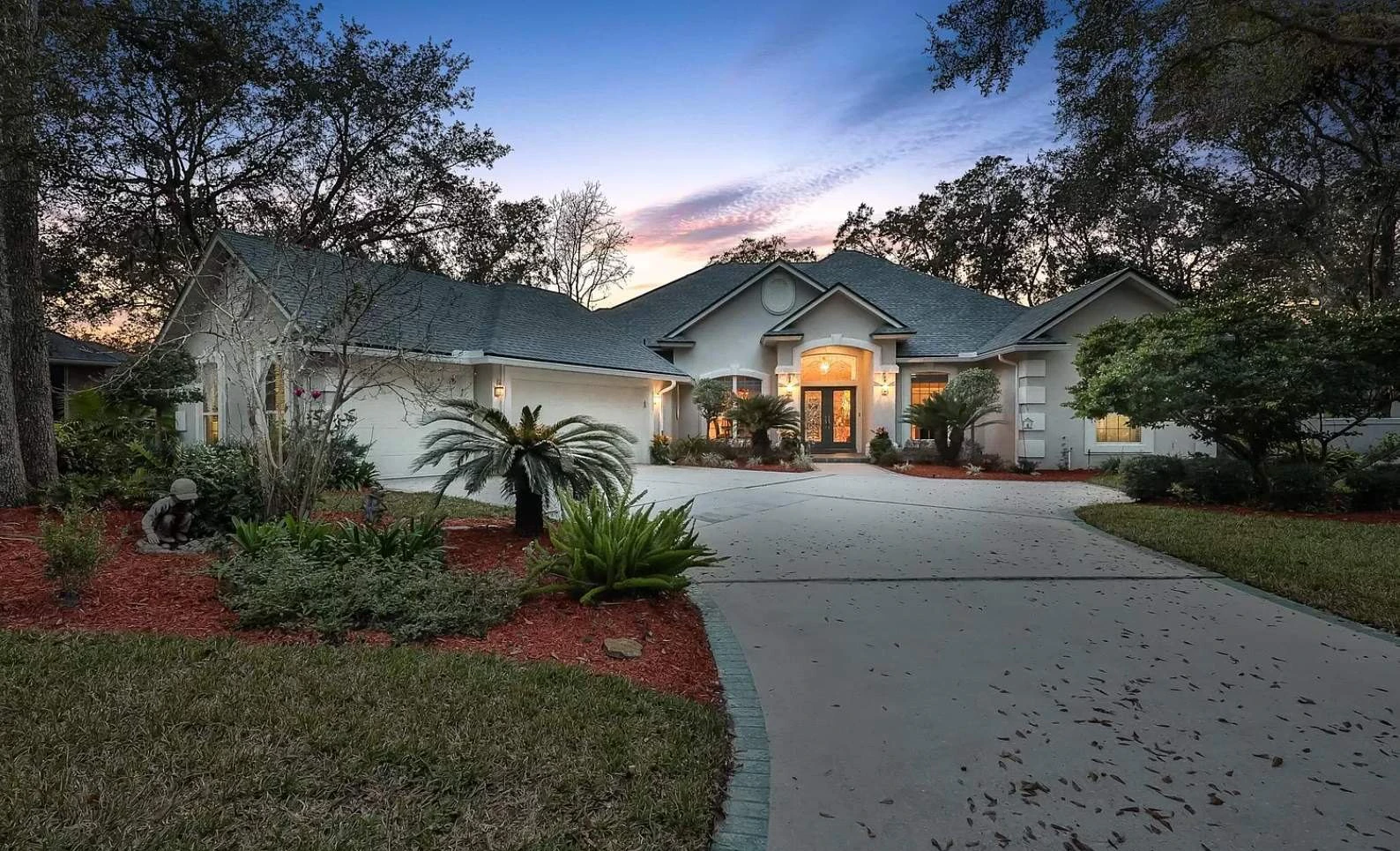 The Queen’s Harbour home before painting, in the older beige with green-grey trim, Jacksonville FL 32225