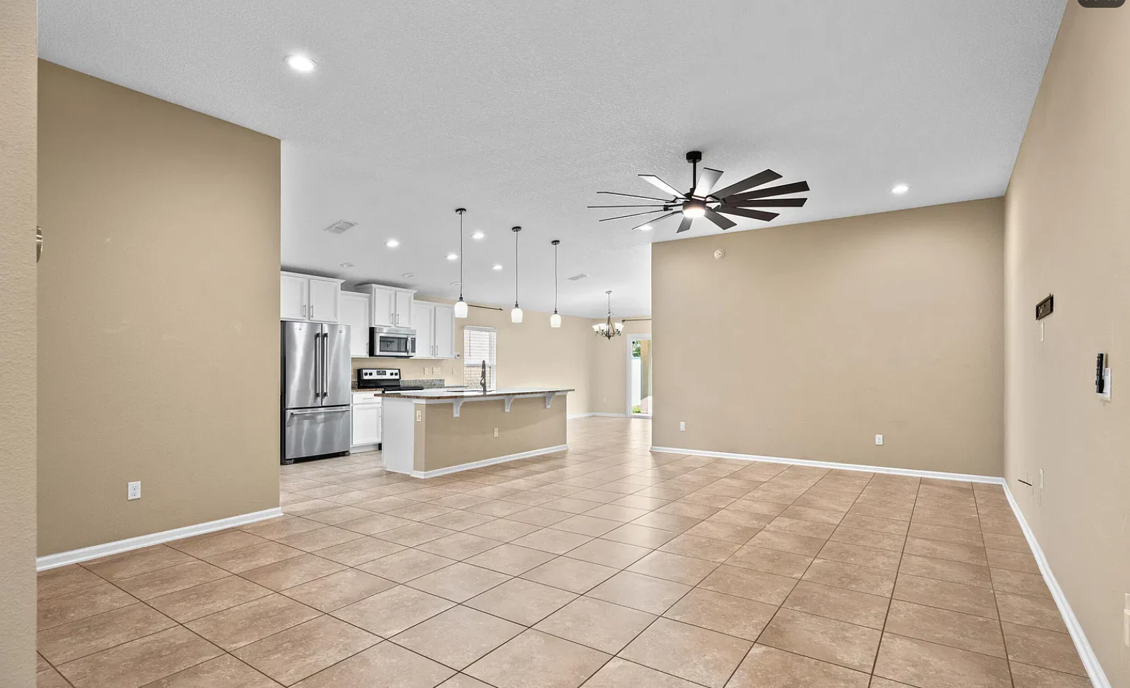 Before the complete interior and cabinet painting in Yellow Bluff Hideaway, North Jacksonville, with drywall repairs and a smooth, spray-finished cabinet transformation. in North Jacksonville, FL