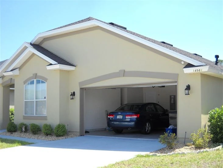 Residential exterior painters completing a Jacksonville FL home repaint