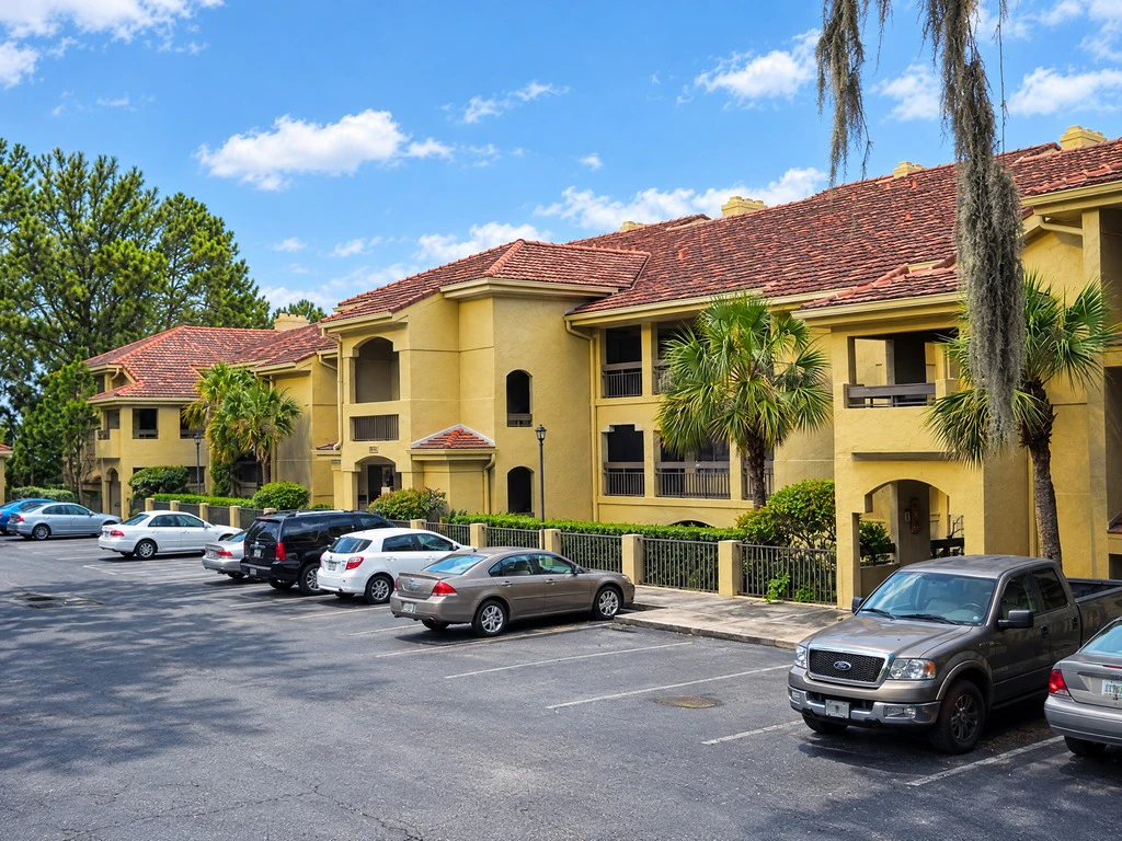 Yellow stucco condominium buildings after exterior painting
