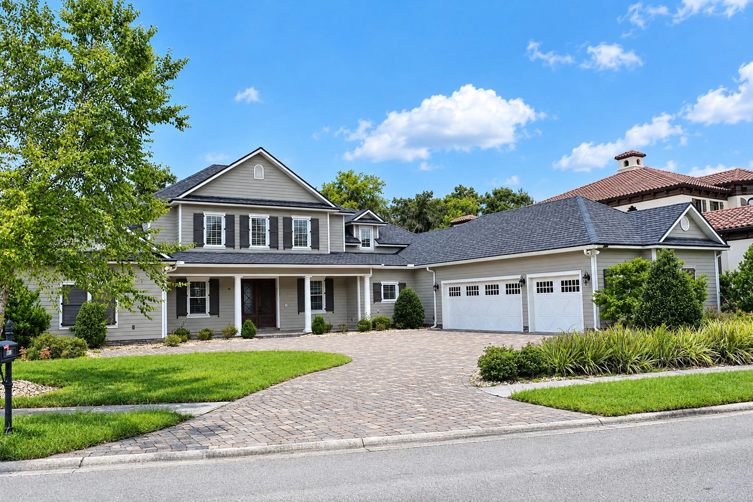 Exterior painting contractors preparing a Fleming Island, FL home for paint