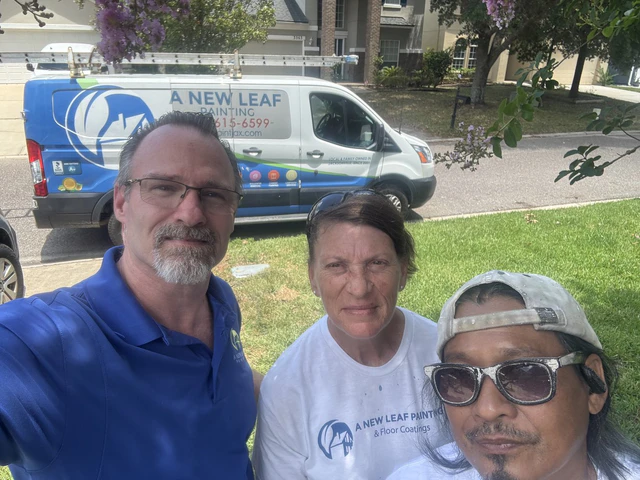 The owner with two of the A New Leaf crew in front of the company van