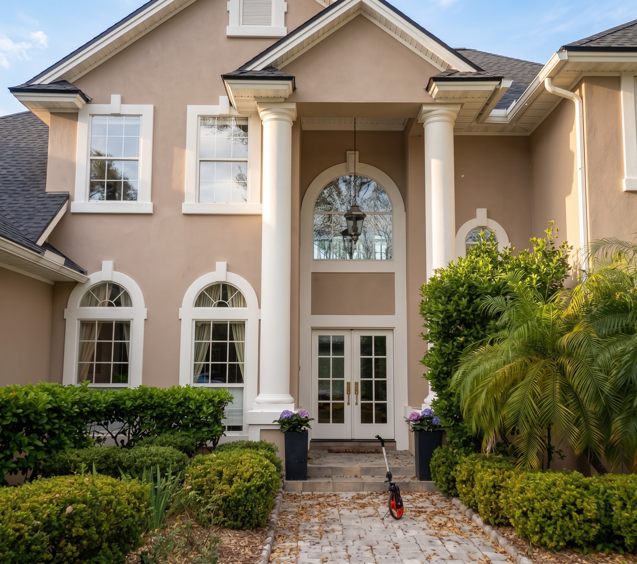 Before the Large Stucco Home Exterior Painting in Marsh Landing | Ponte Vedra Beach, FL in Ponte Vedra Beach, FL