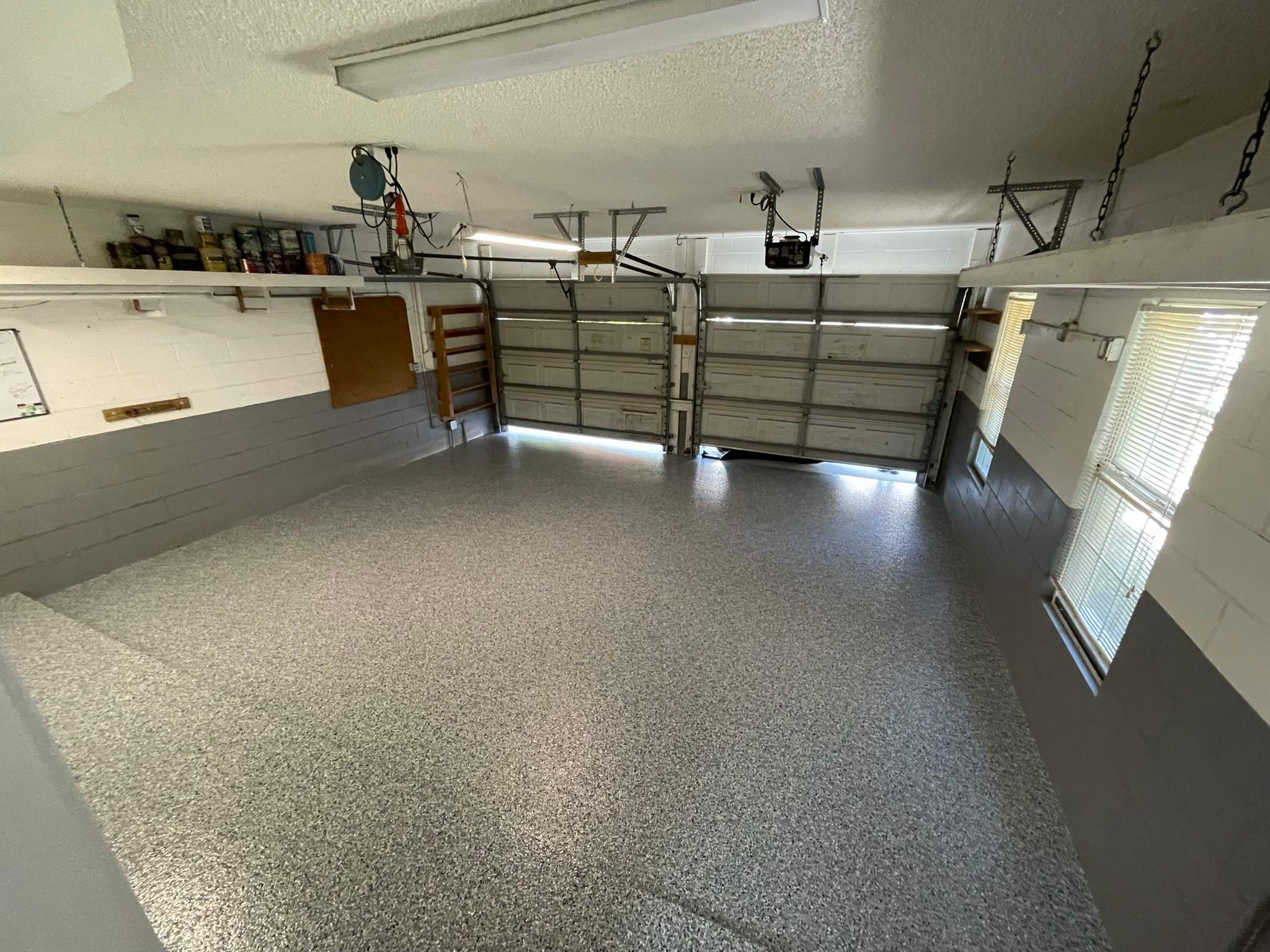 Garage in Mandarin, Jacksonville FL after a polyurea and polyaspartic floor coating, gray flake finish