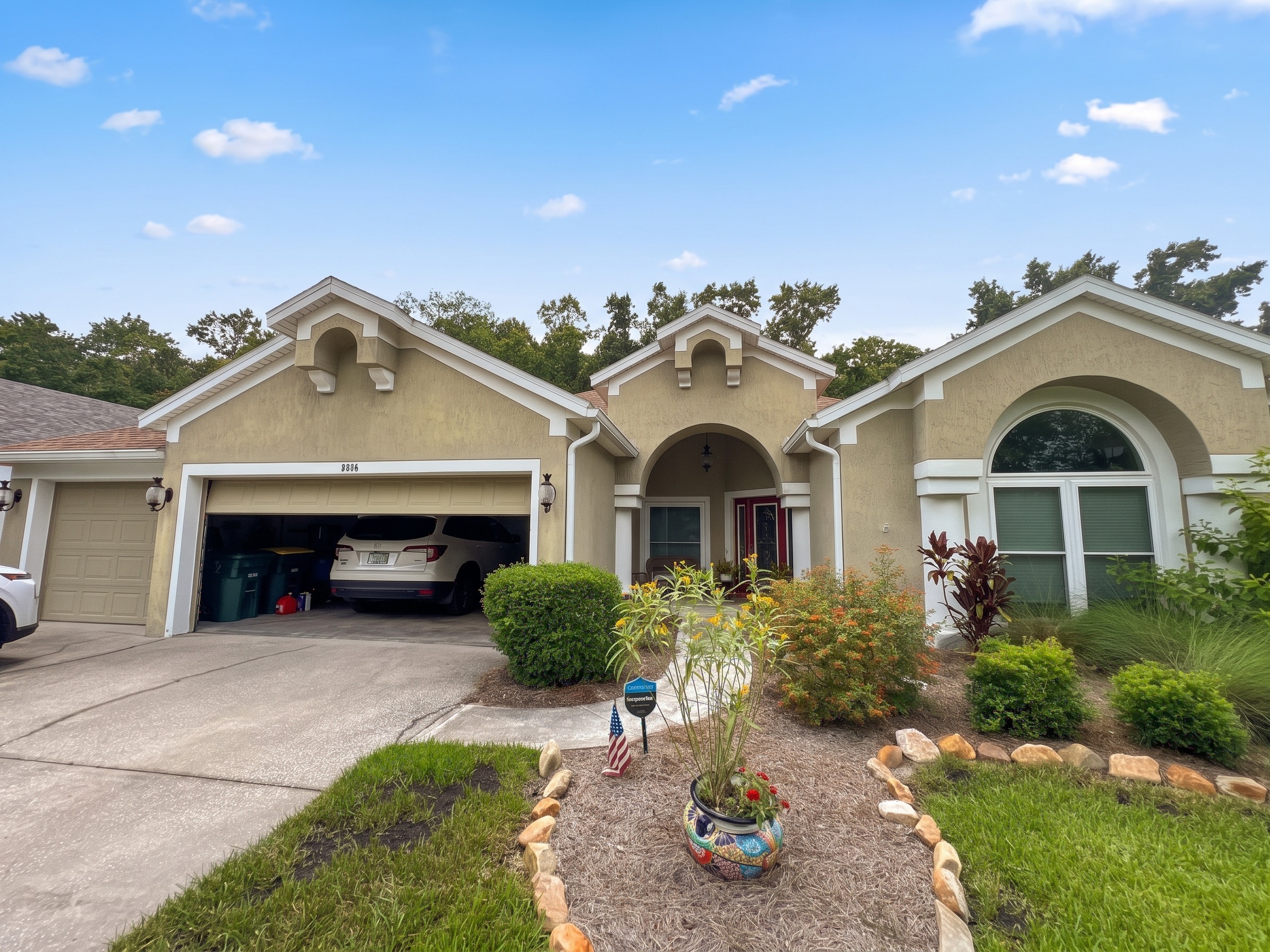 Before the Stucco Exterior Repainting with White Soffits & Fascia | Hampton Park, Jacksonville, FL in Jacksonville, FL