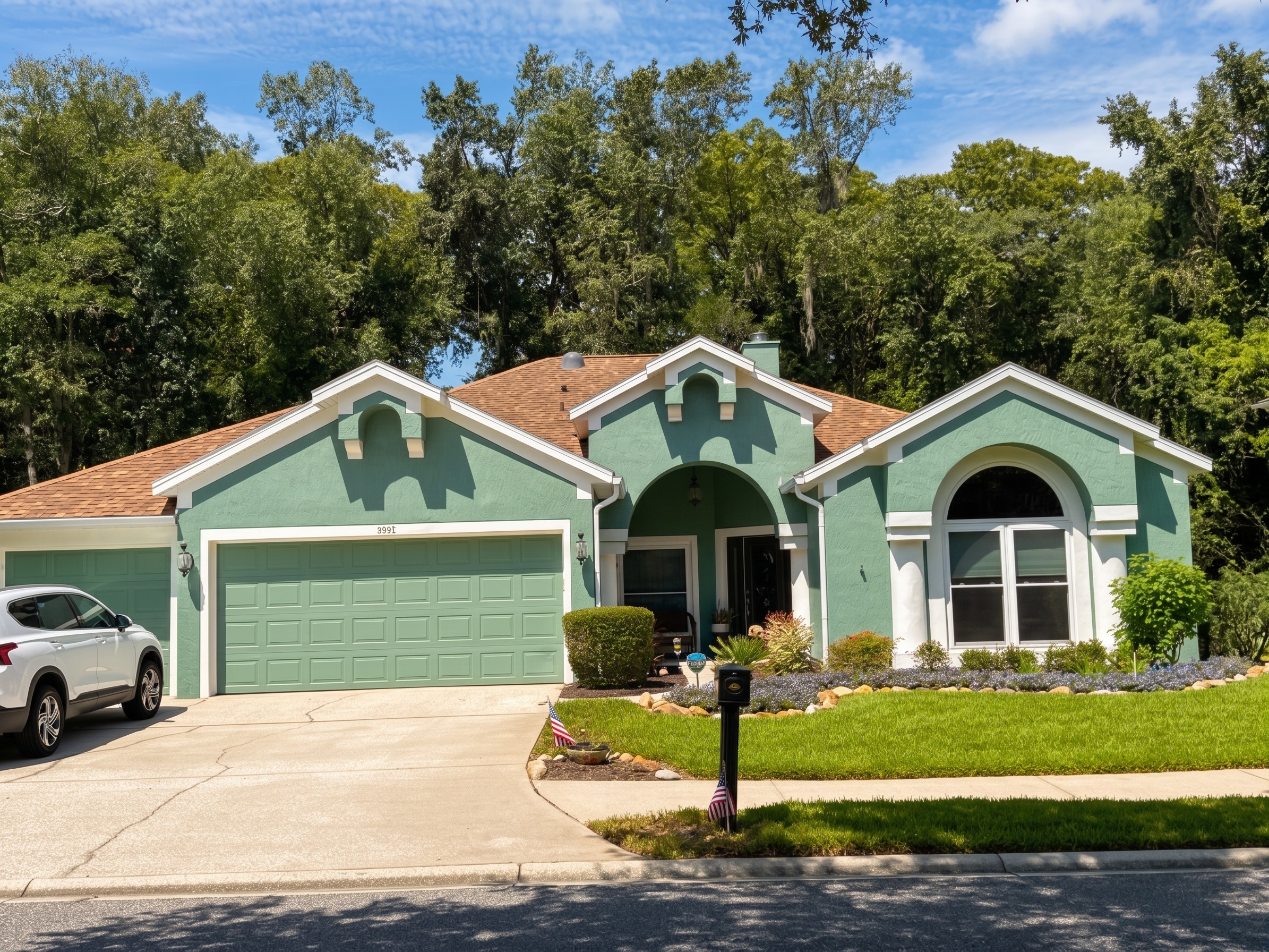 After the Stucco Exterior Repainting with White Soffits & Fascia | Hampton Park, Jacksonville, FL in Jacksonville, FL