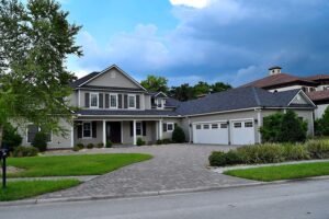 Exterior painting contractors preparing a Fleming Island, FL home for paint