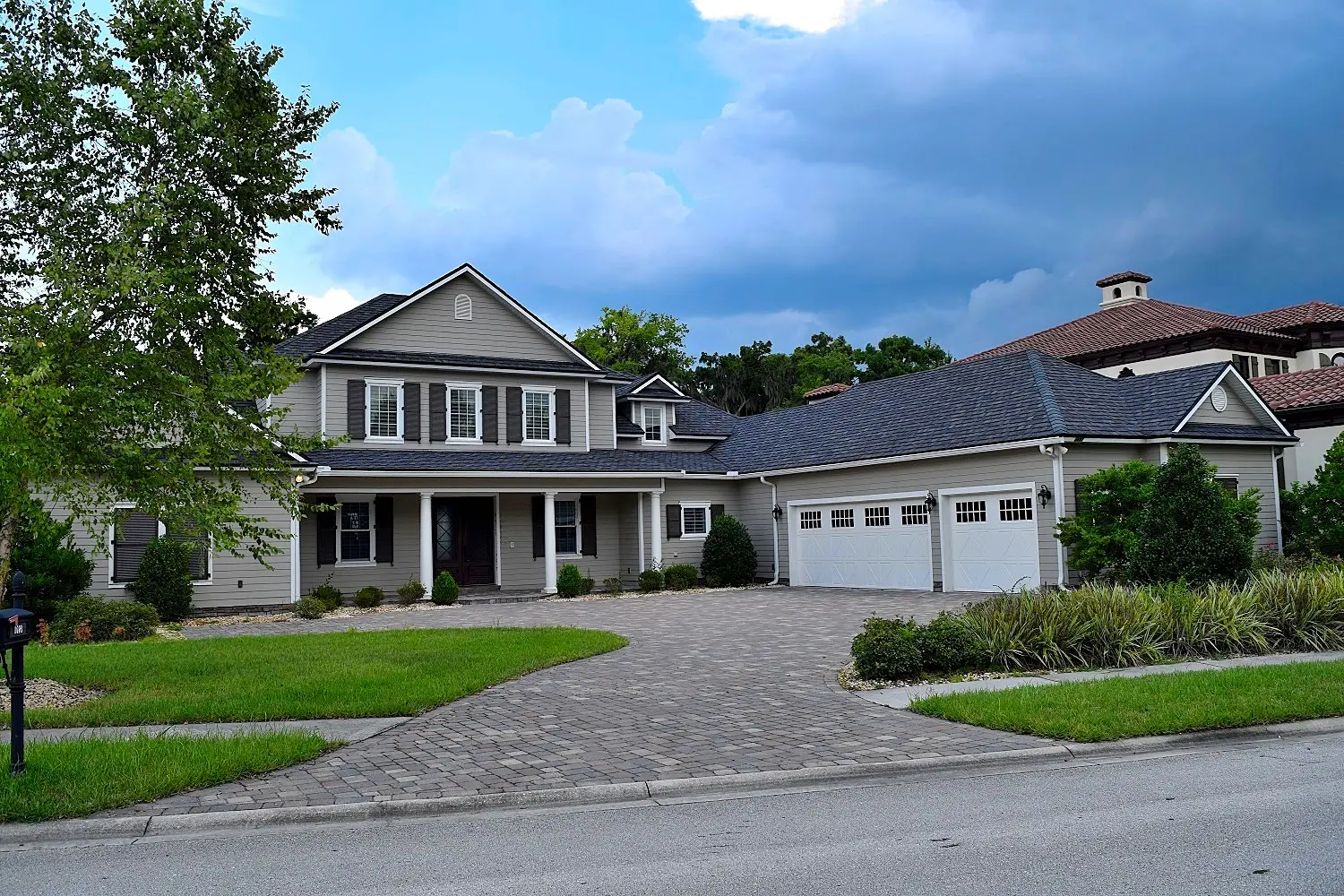 Exterior painting contractors preparing a Fleming Island, FL home for paint