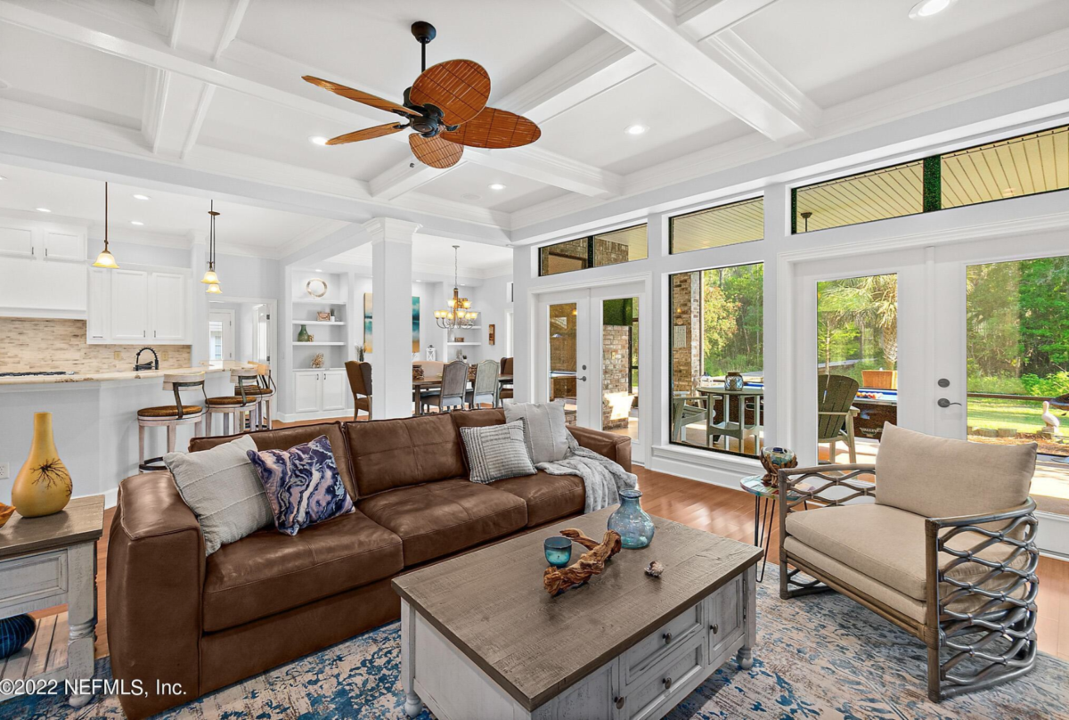 Interior painting Jacksonville Florida family room with warm neutral walls, white trim, and open comfortable layout