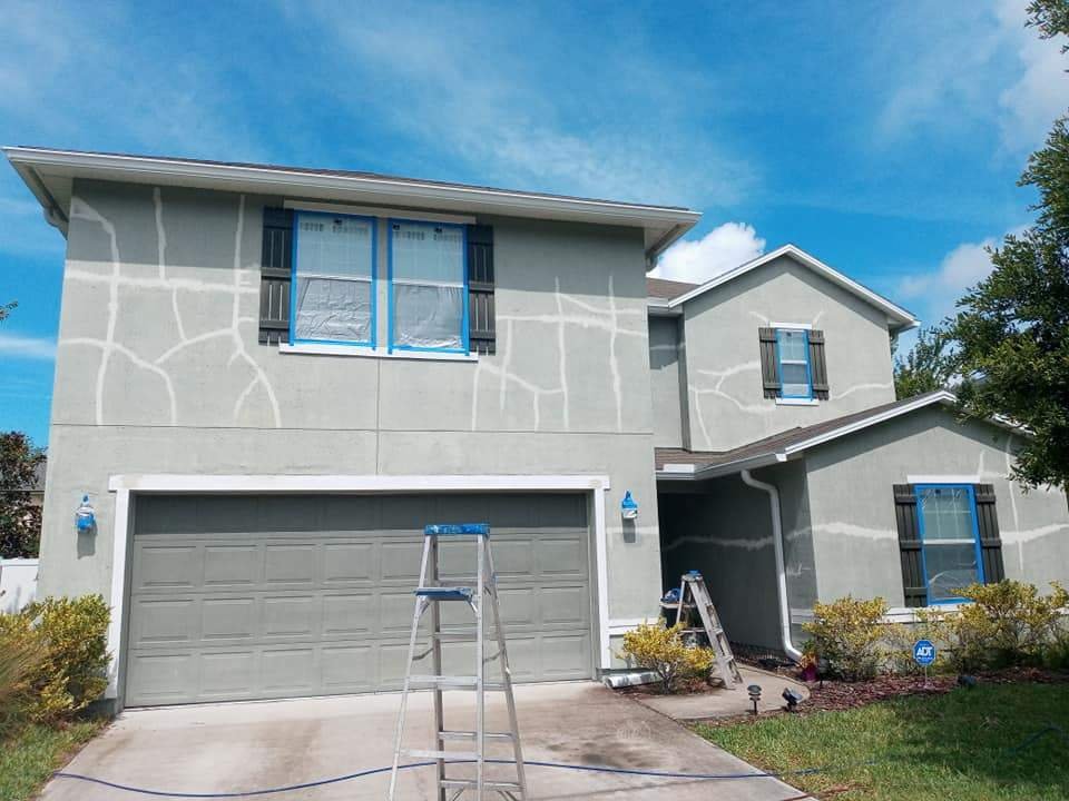 Jacksonville home exterior before painting — faded, mildewed siding and worn trim