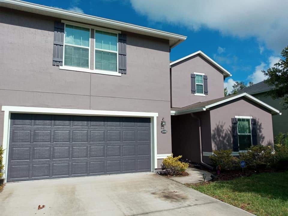 Same Jacksonville home exterior after professional painting by A New Leaf Painting — clean, restored, weather-shielded finish