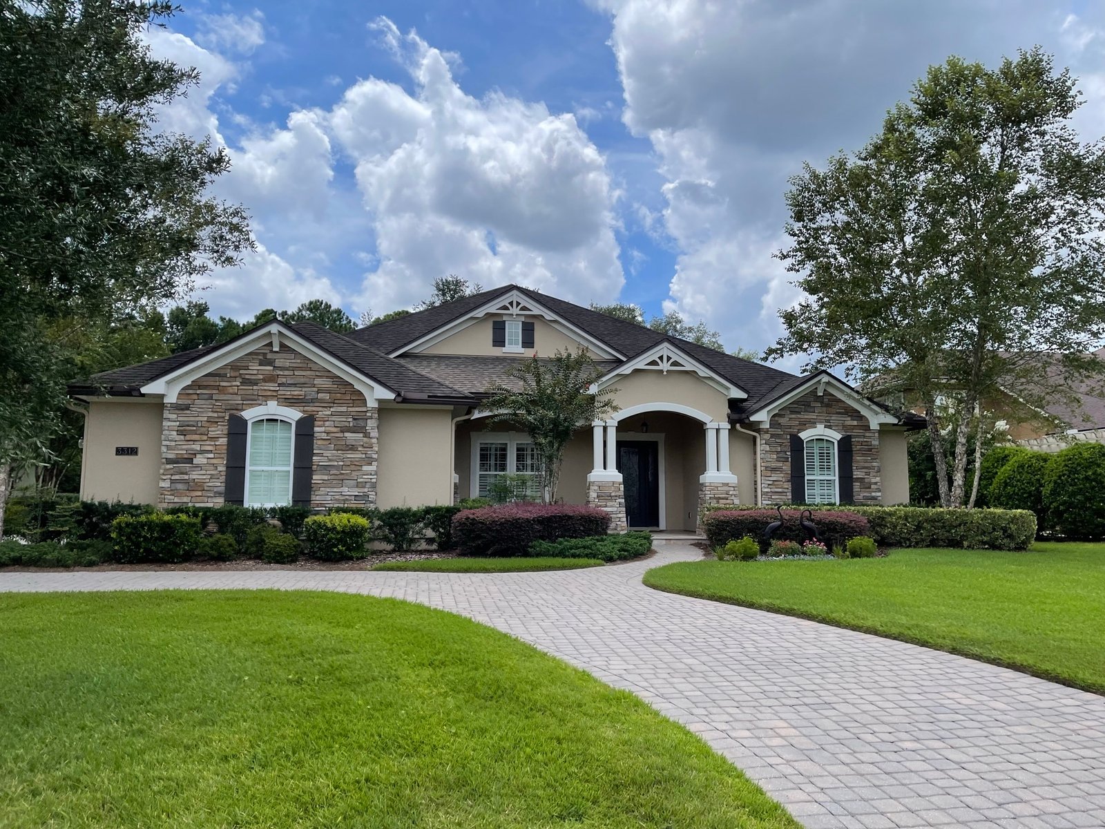 Professional stucco exterior painting project in King and Bear, World Golf Village, Florida