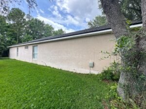 Detailed exterior caulking around joints and transitions before primer and finish paint are applied to a Jacksonville home.