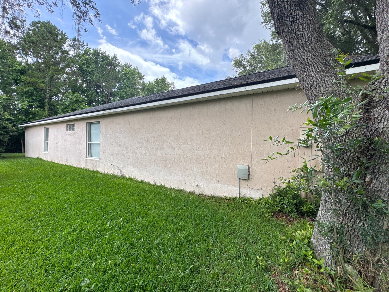 Detailed exterior caulking around joints and transitions before primer and finish paint are applied to a Jacksonville home.