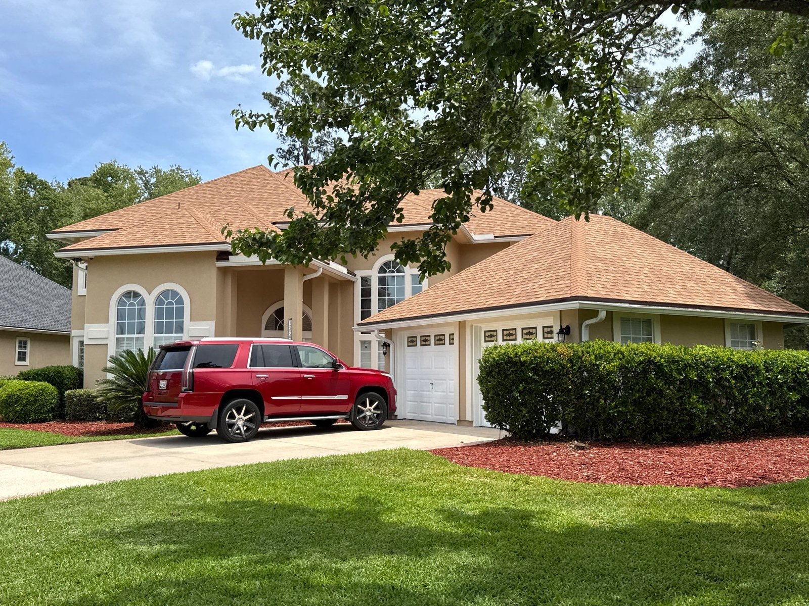 Finished front and right elevation of the EIFS home after exterior painting in Eagle Harbor