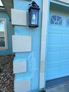 Previously repaired stucco crack reopening on exterior wall