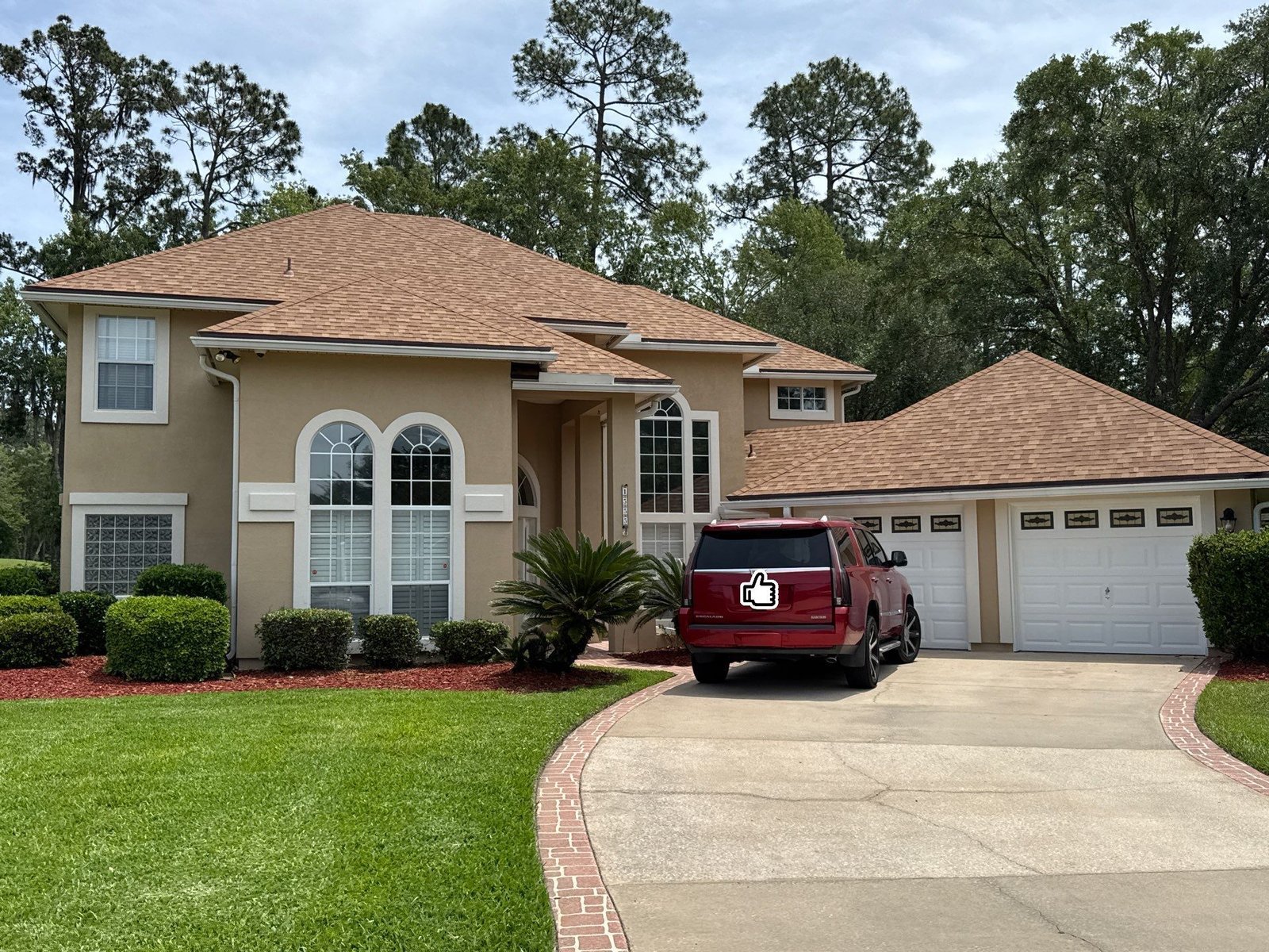 Completed front exterior of the synthetic stucco home after painting in Eagle Harbor, Fleming Island FL.