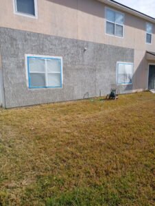 Completed exterior stucco repair after removal of loose and delaminated material