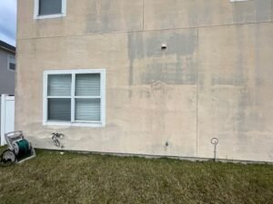 Stucco delamination on Jacksonville home before exterior stucco repair