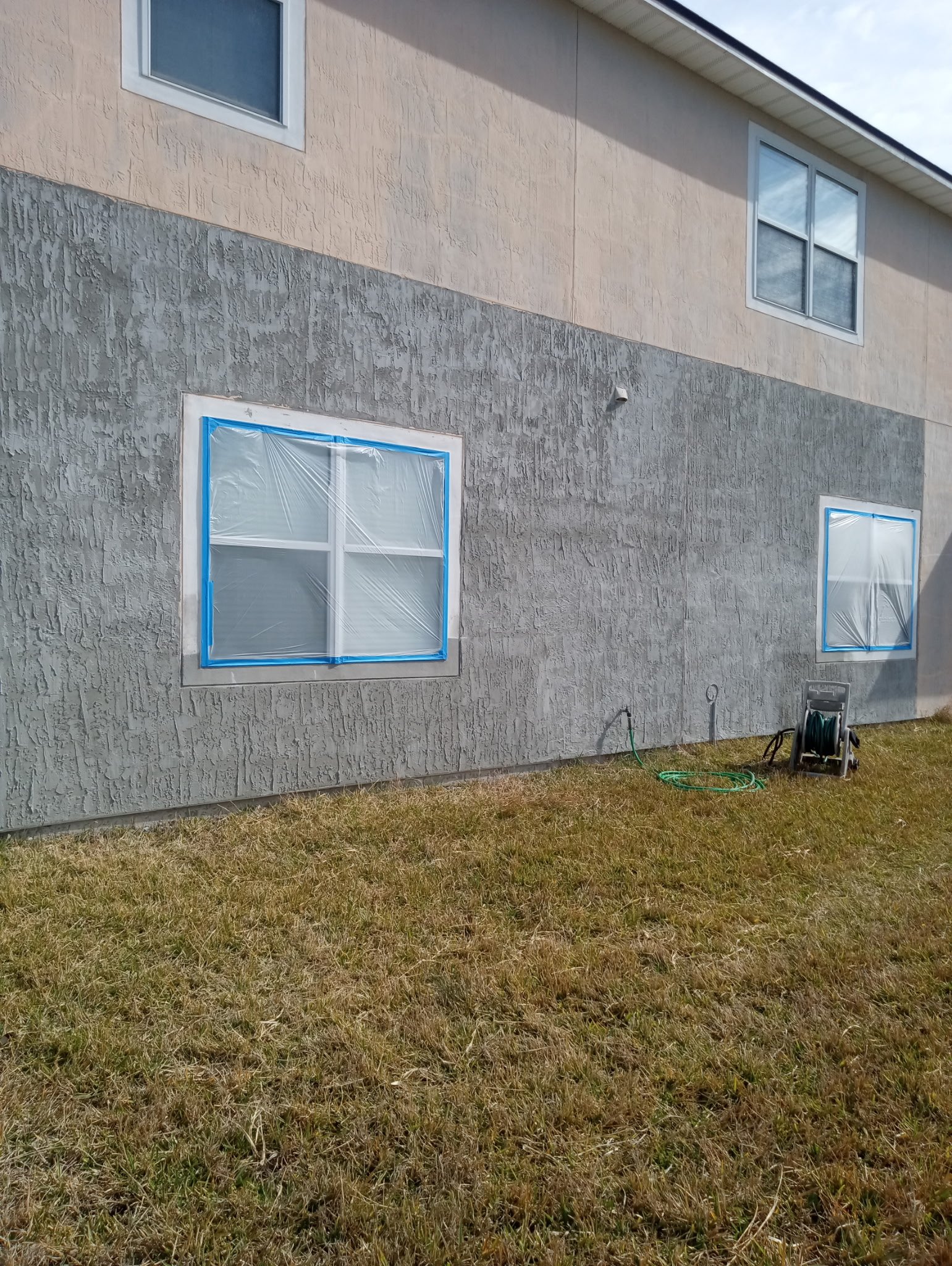 Stucco patch repair completed after the damaged area was removed