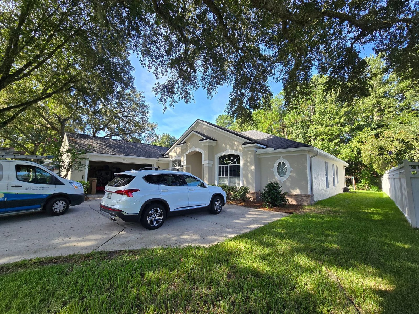Stucco surface preparation before exterior painting on a Jacksonville, FL home