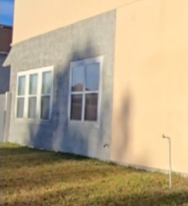 Jacksonville stucco home after exterior repairs and complete house painting